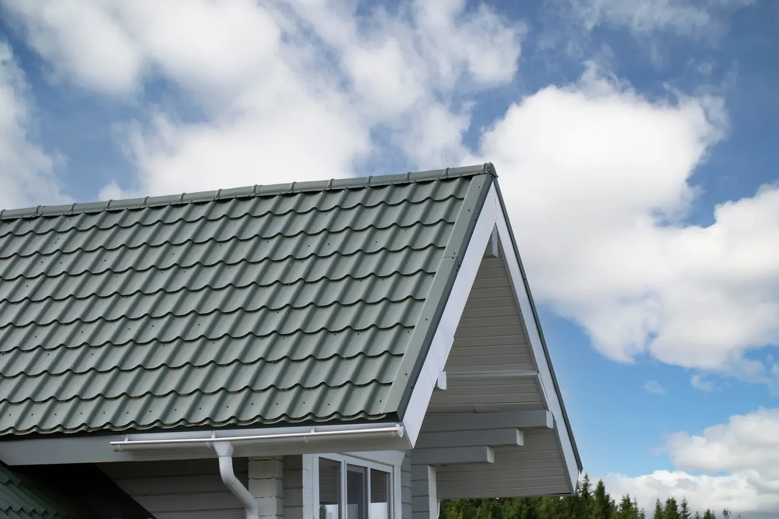 A new tile roof being installed on a residential building. | You First Home Services