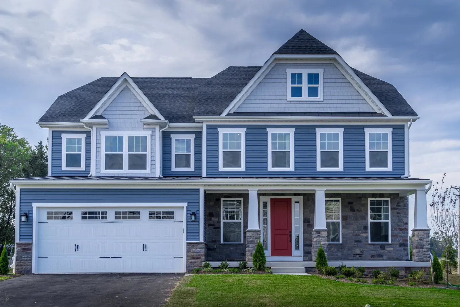 A residential home with new vinyl siding being installed. | You First Home Services