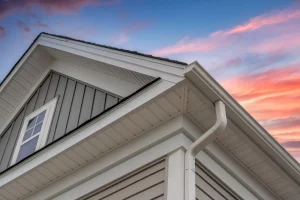 A residential gutter installation featuring aluminum gutters, approved by a hero, with options for replacement and repair. | You First Home Services