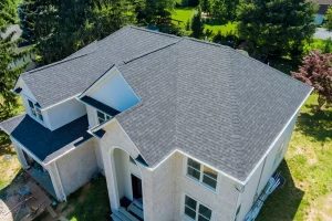 A newly installed asphalt shingle roof on a residential building | You First Home Services