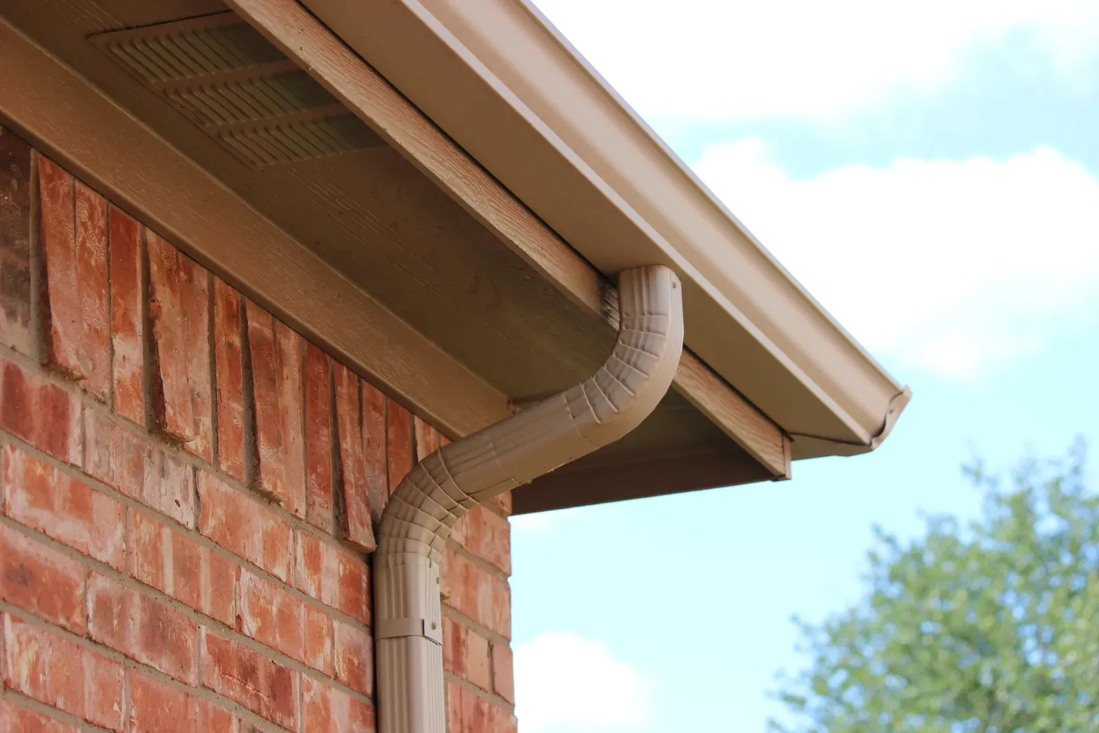 A new aluminum gutter being installed on a residential building, with the tags "gutter, gutter replace, gutter repair, gutter install, gutter aluminum, residential" | You First Home Services