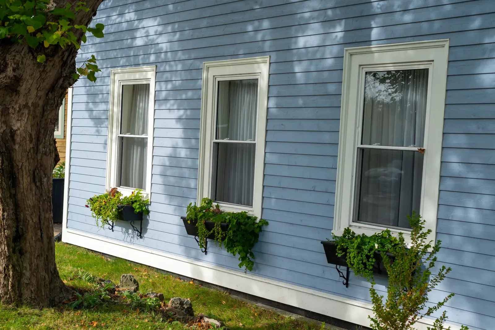 A double-hung residential window being replaced and installed. | You First Home Services