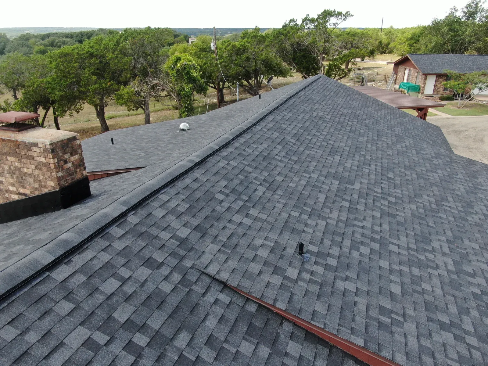 A residential roof being replaced after an impact | You First Home Services