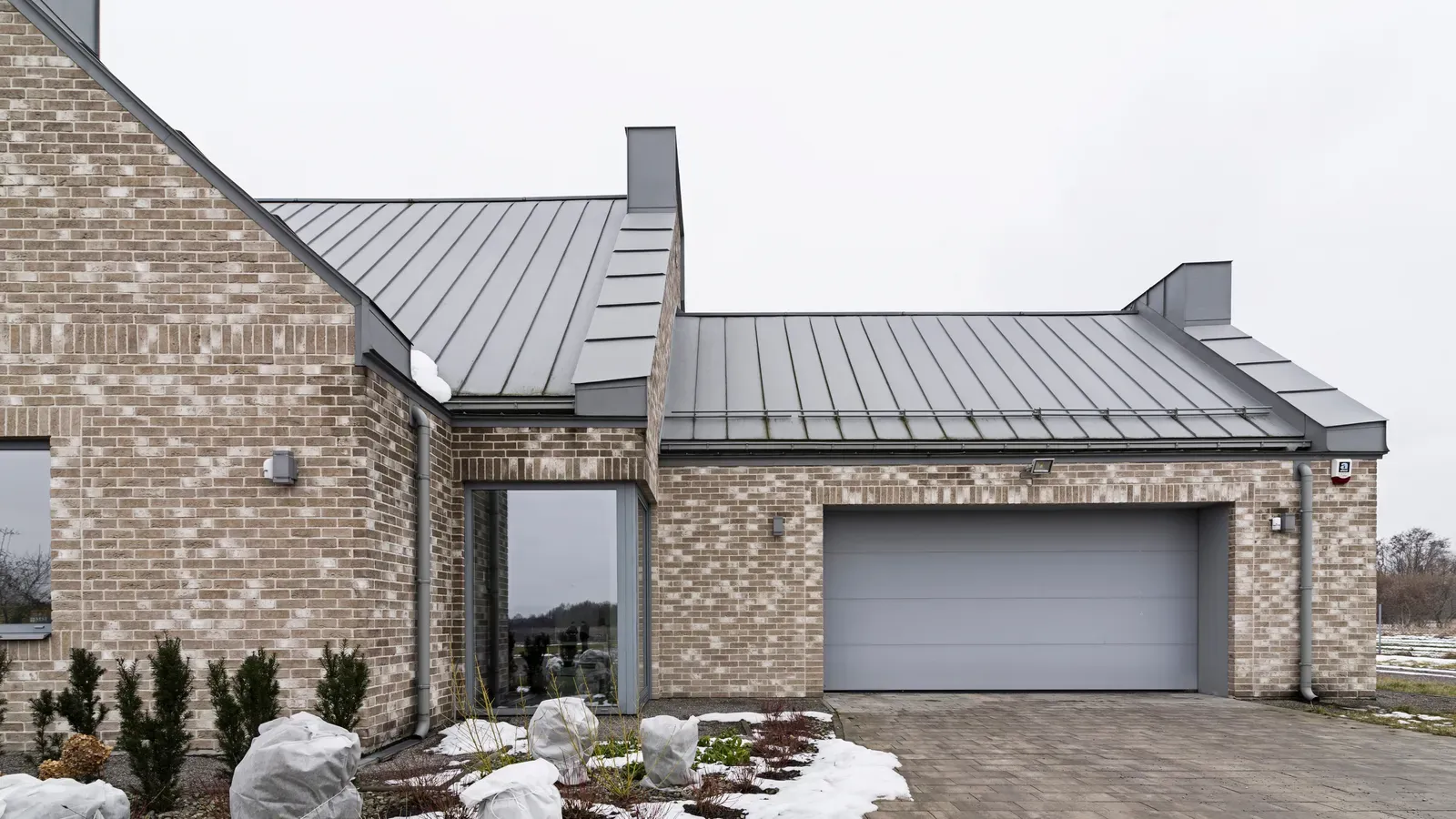 A newly installed metal roof on a residential building. | You First Home Services