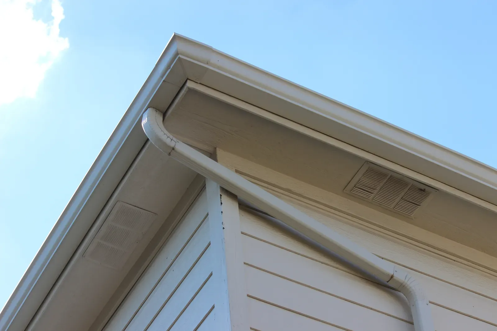 A residential aluminum gutter installation being hero-approved, with options for replacement and repair. | You First Home Services