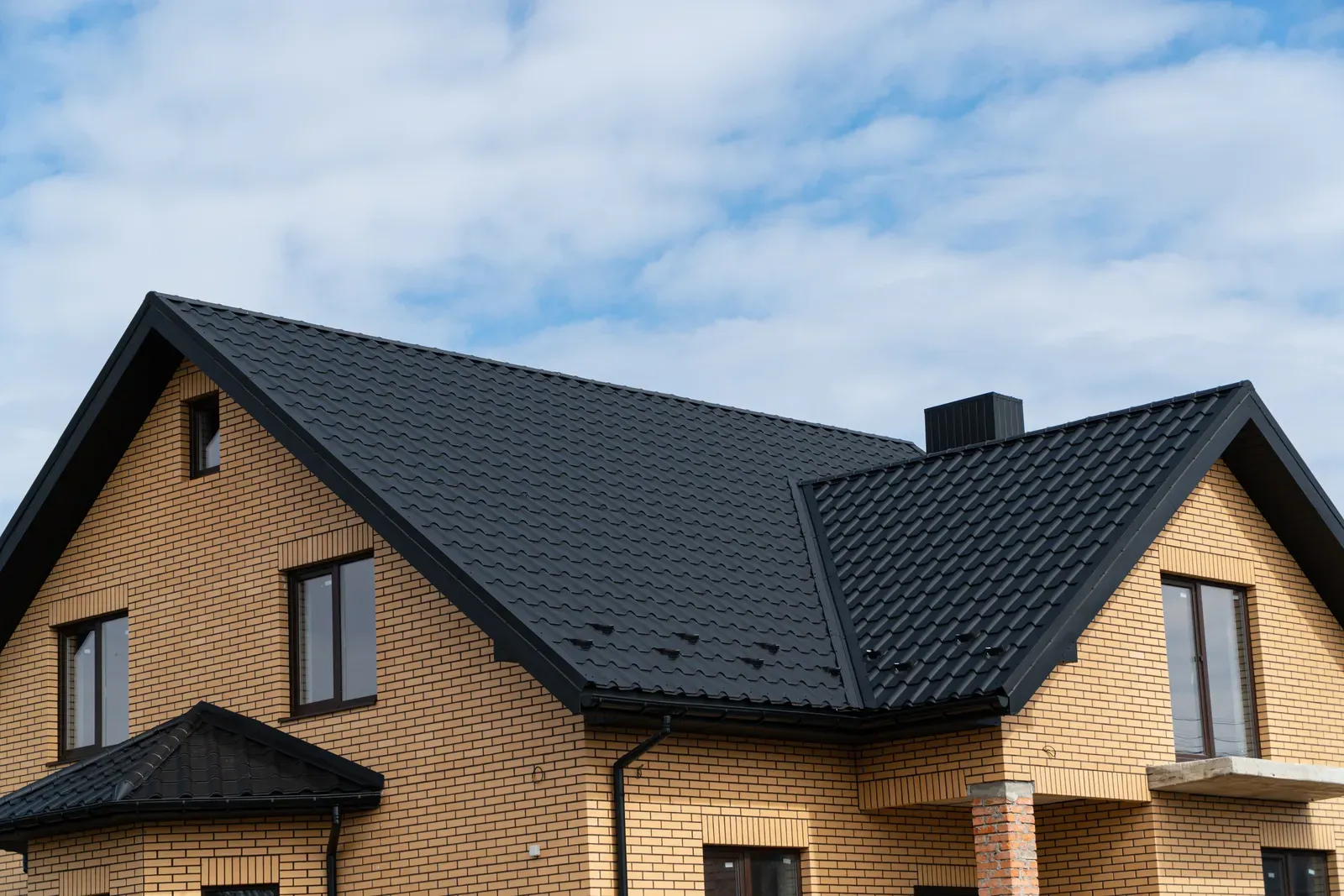 A new tile roof being installed on a residential home, guaranteed hero-approved. | You First Home Services