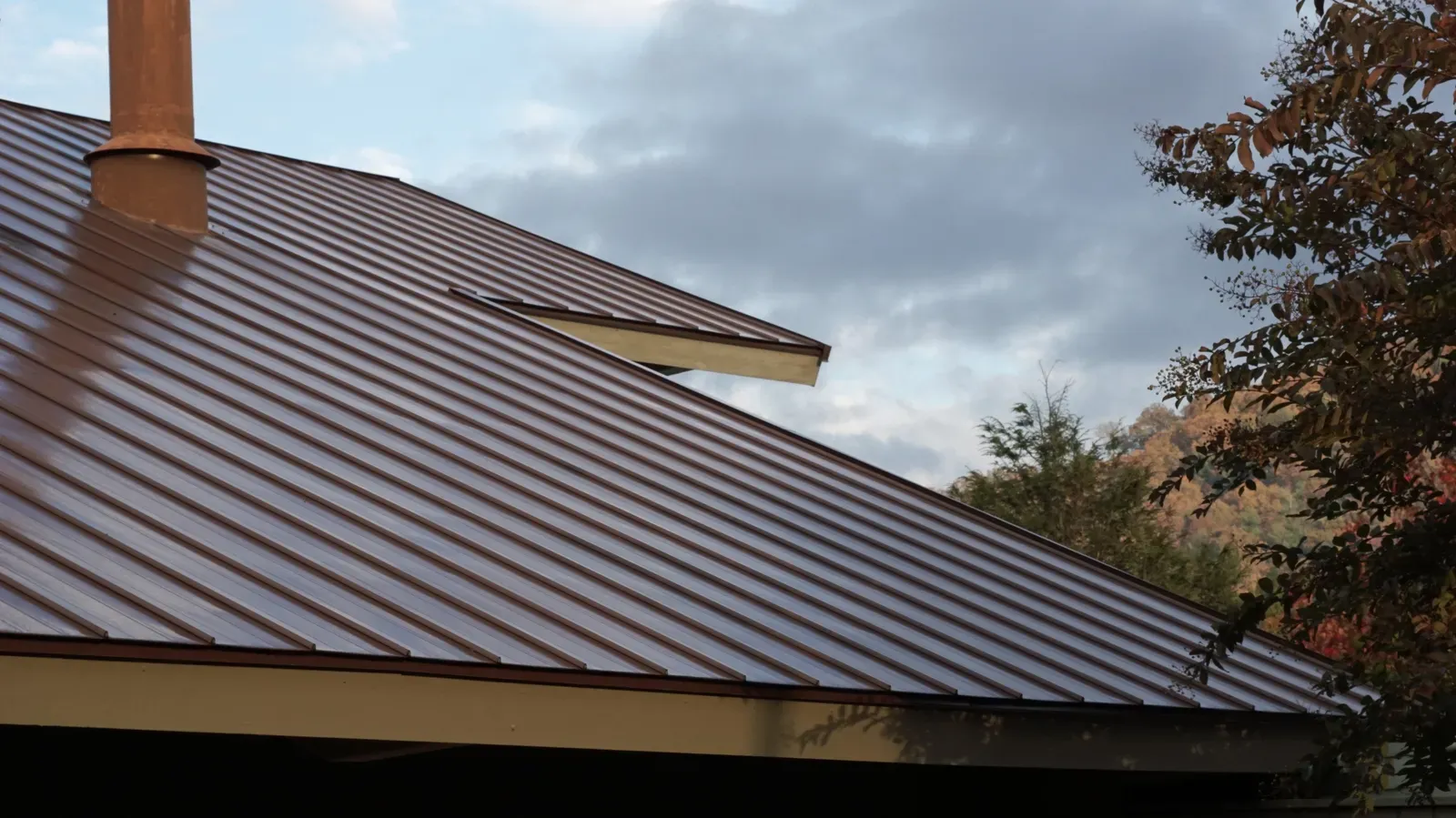 A new metal roof being installed on a residential building, approved by a trusted hero. | You First Home Services